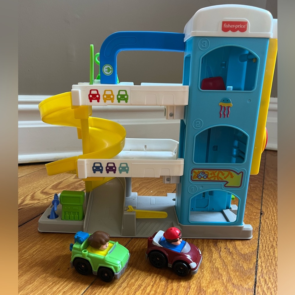 Fisher price toy garage with two cars